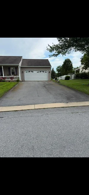Aged faded driveway before asphalt restoration in Lebanon PA
