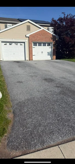 Worn weathered driveway before professional resealing