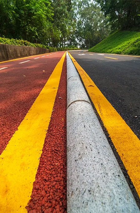 Painted pavement markings showing clear traffic lines and curb markings